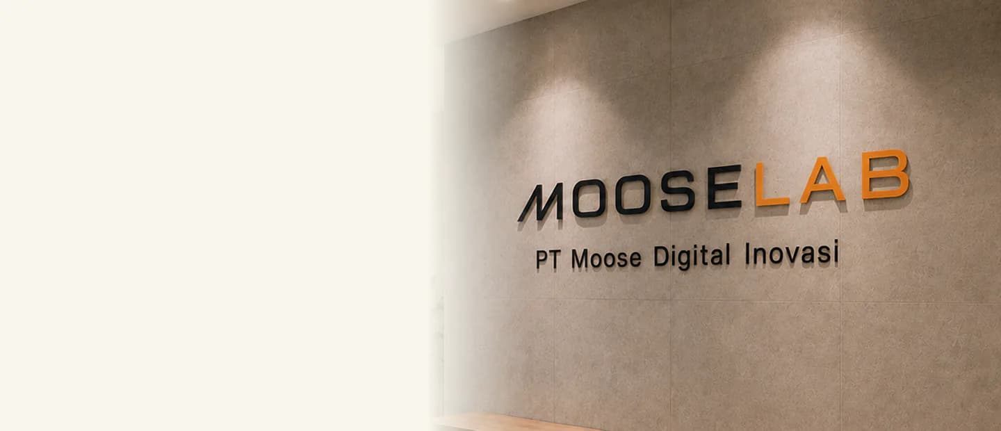 Mooselab signage reading 'MOOSELAB — PT Moose Digital Inovasi' on the office reception wall