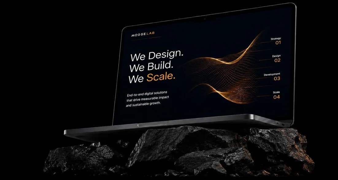 Mooselab laptop mockup displaying 'We Design. We Build. We Scale.' with the strategy, design, development, and scale process markers
