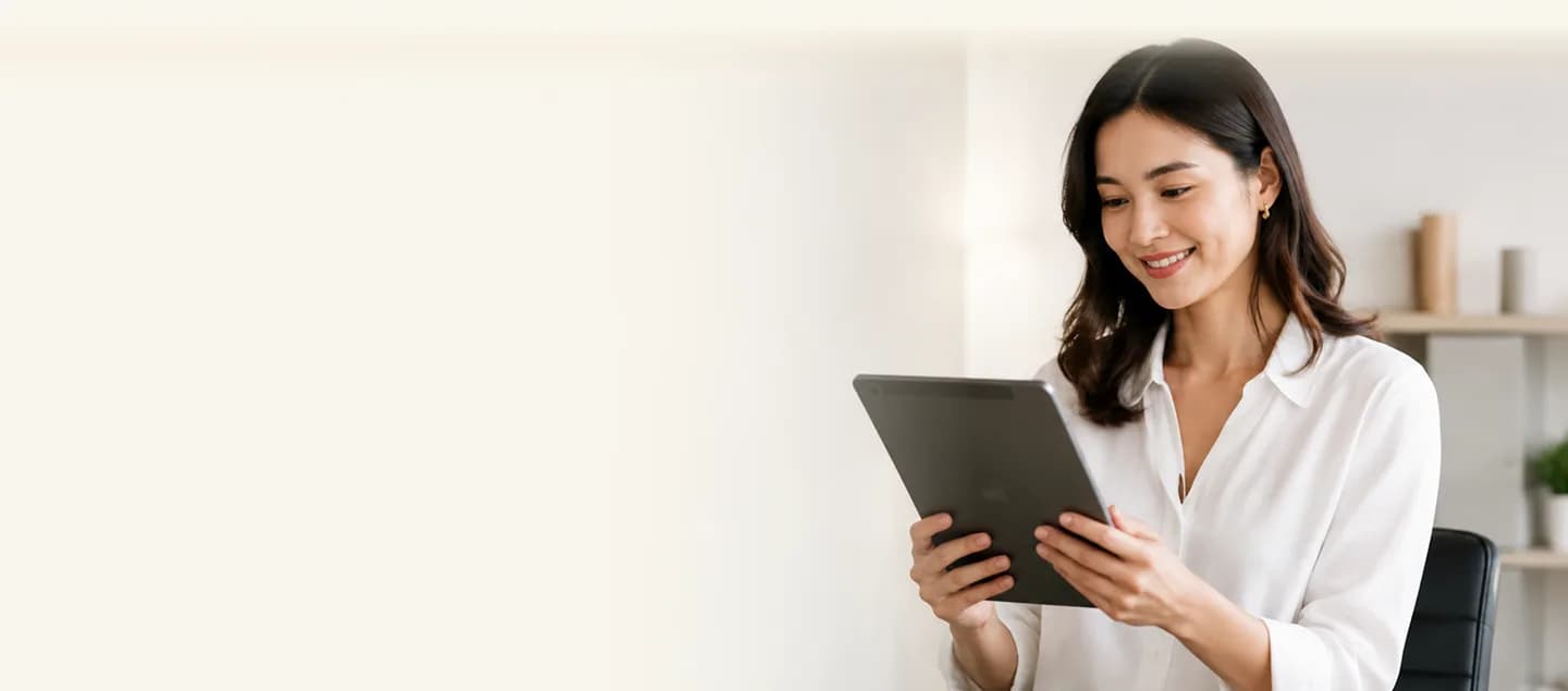 Mooselab team member reviewing work on a tablet in a bright office